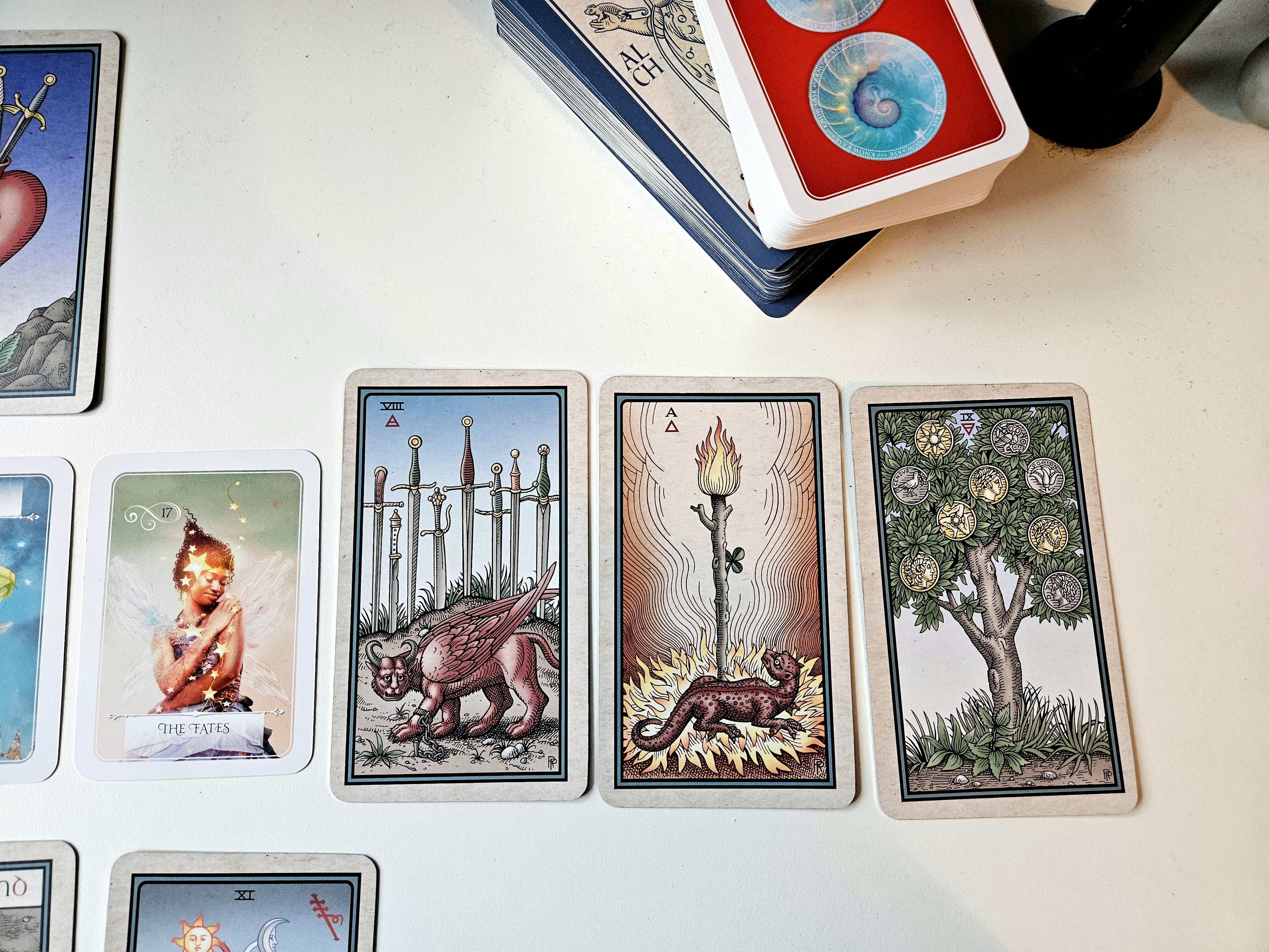 Spread right: Eight of Swords, Ace of Wands, Nine of Pentacles